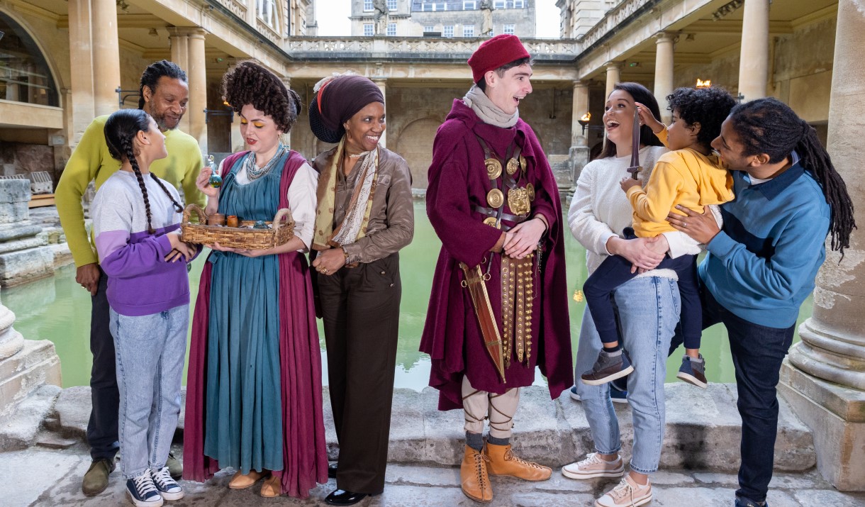 Family with Roman characters at Roman Baths